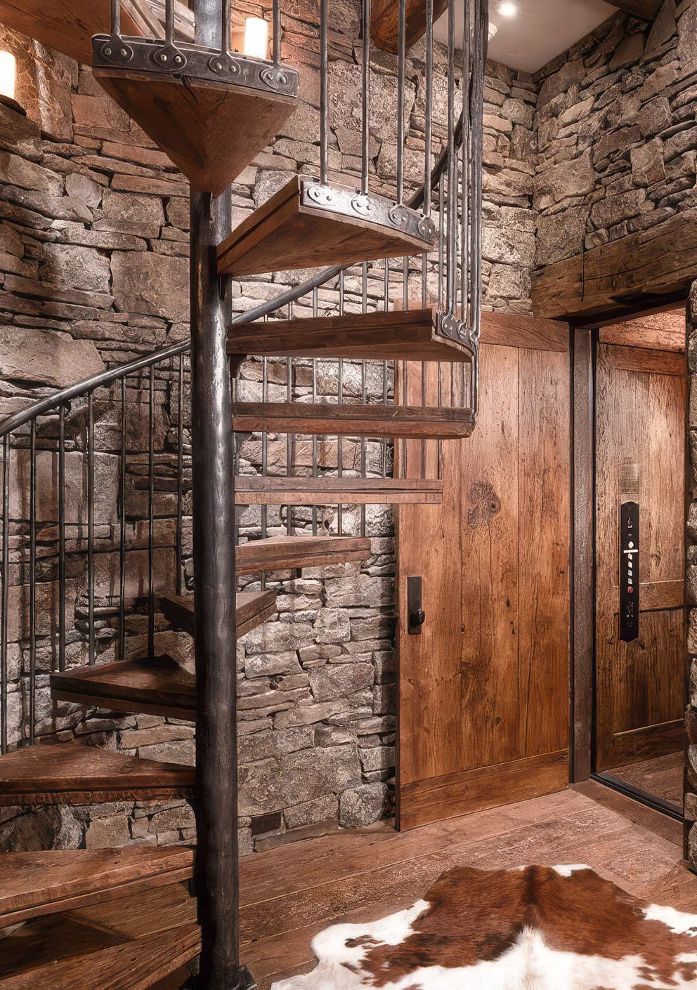 A spiral stair in reclaimed oak and forged iron