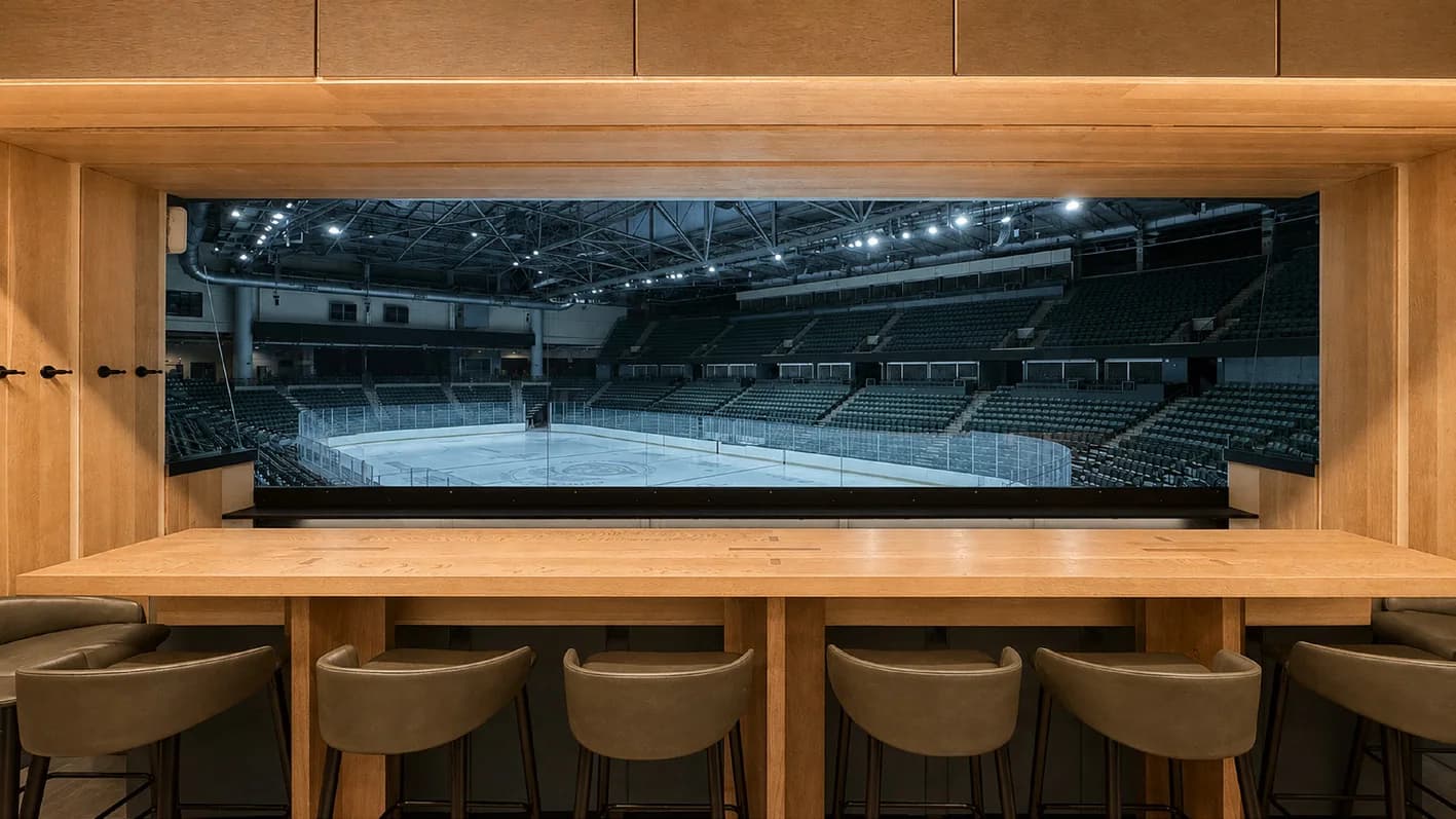 A timber clad hospitality suite overlooking an arena