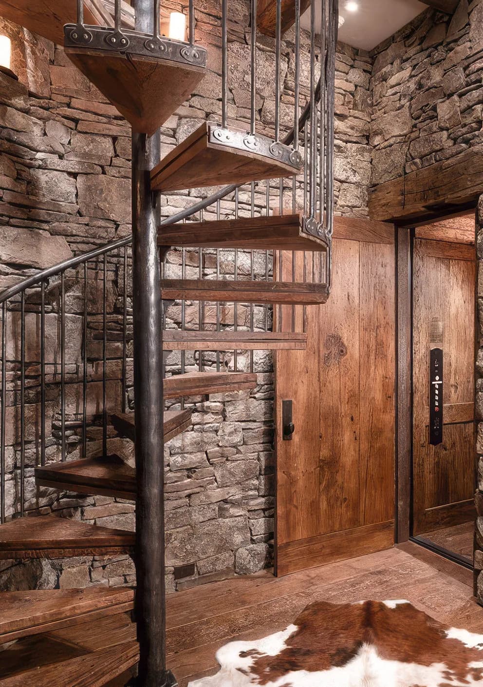 A spiral stair in reclaimed oak and forged iron