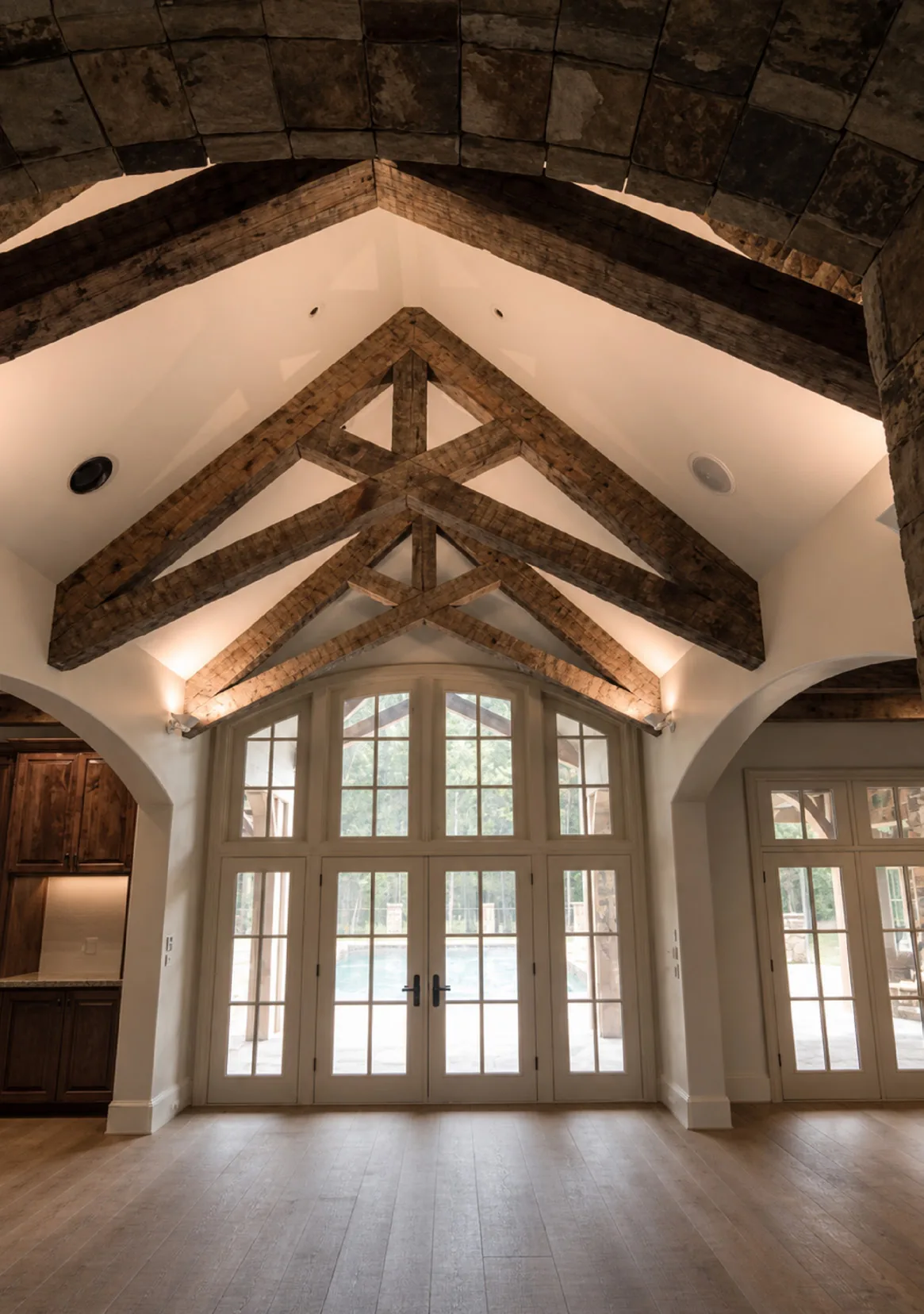 Arched scissor trusses in reclaimed white oak