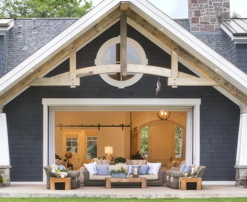 A covered porch under a timber gable