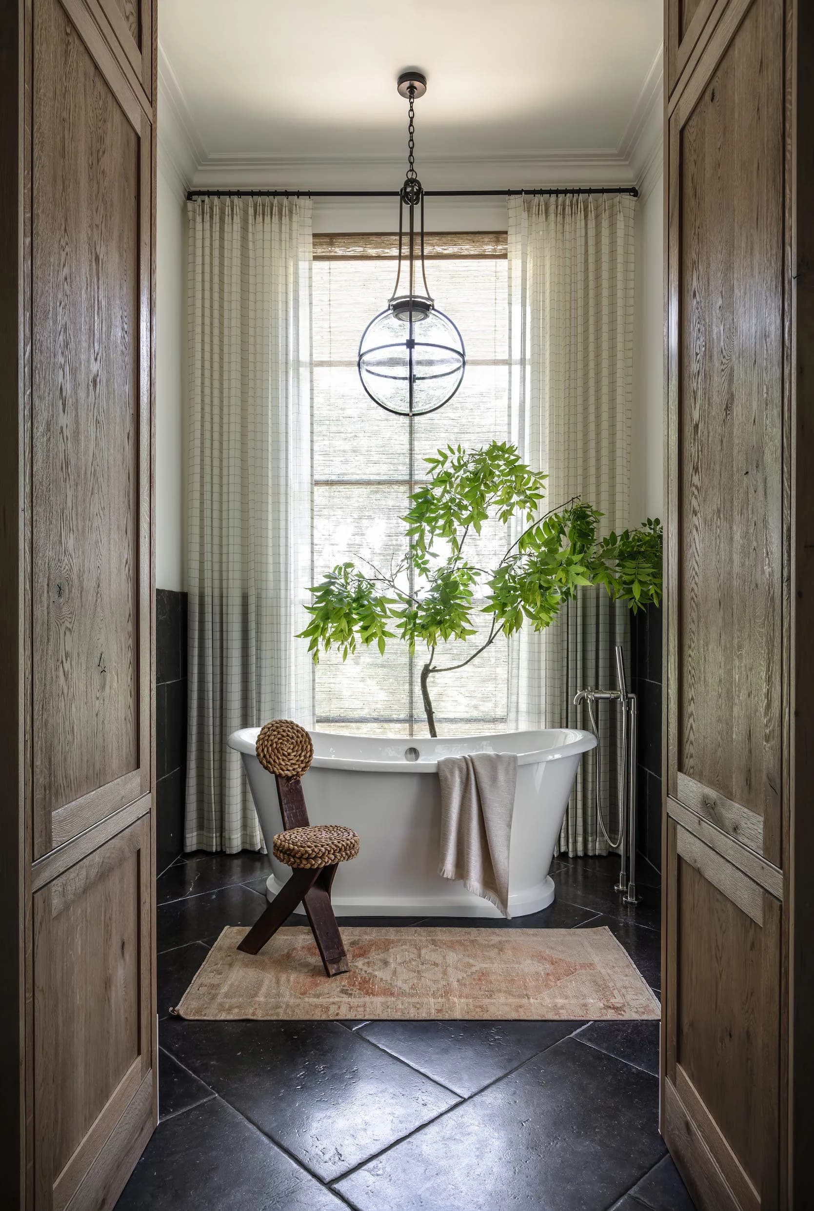 A bathroom framed by timber cladding